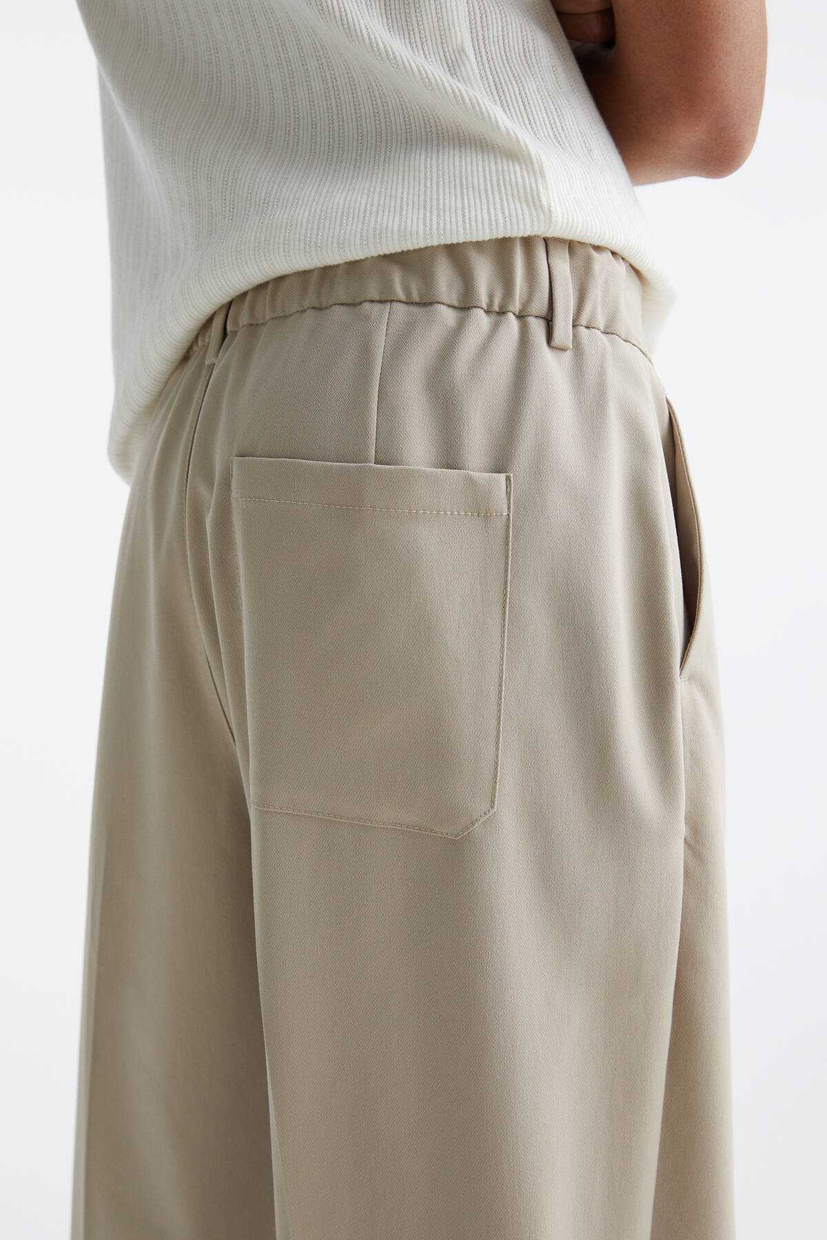 شلوار پارچه ای ساق گشاد