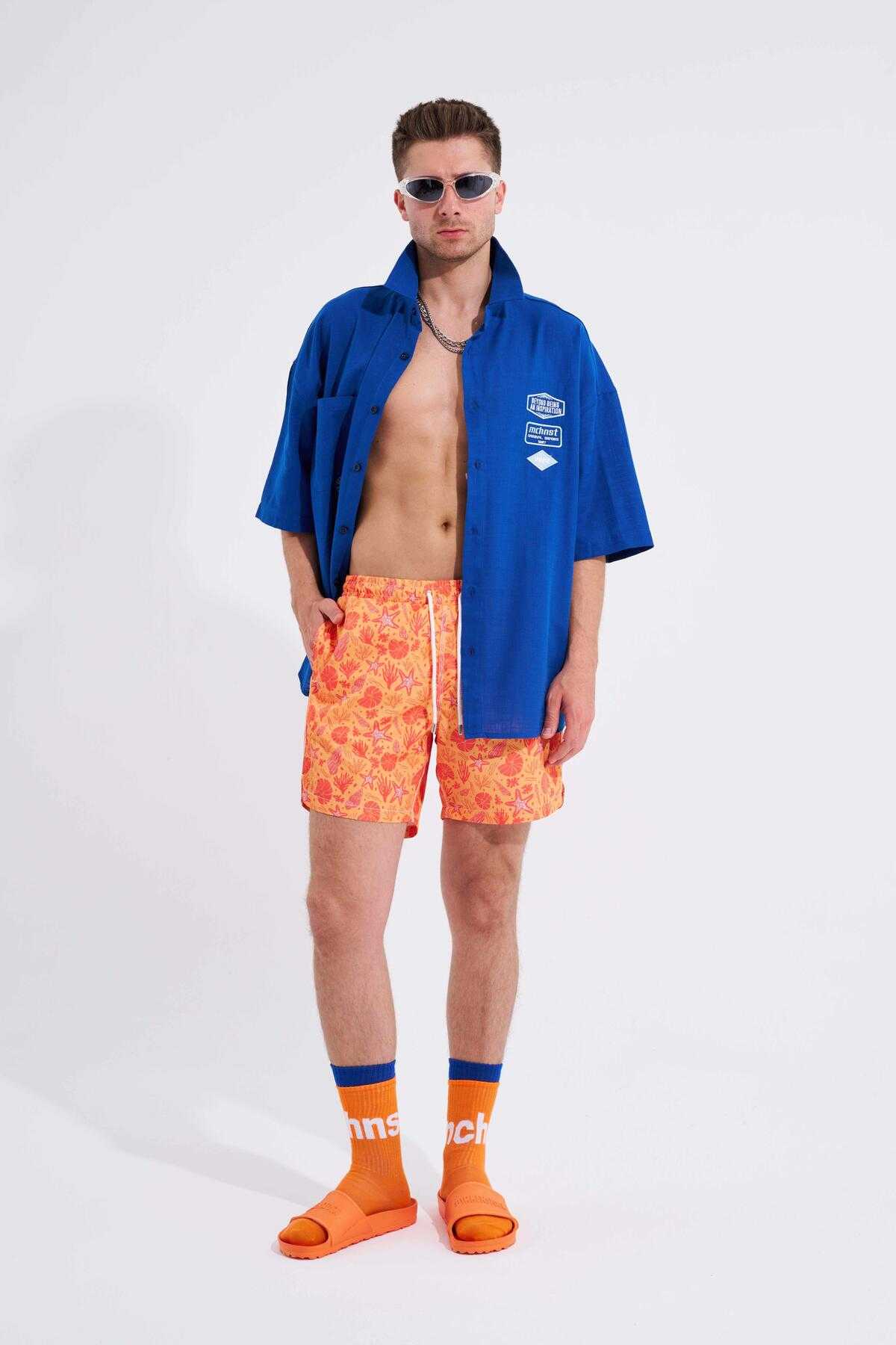 شلوار شنا مردانه با چاپ صدف زرد