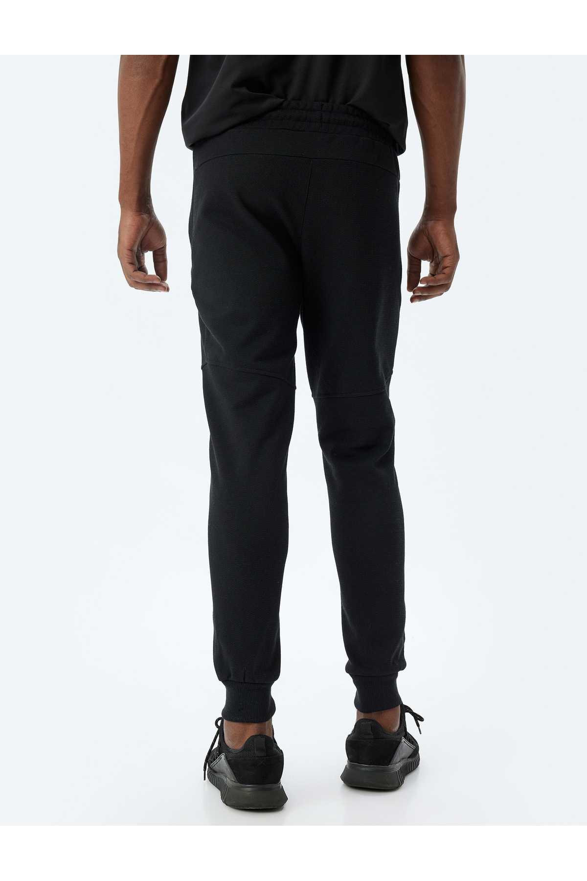 شلوار ورزشی اسپرت دوخت توری دور کمر ترکیبی پنبه ای با جزئیات